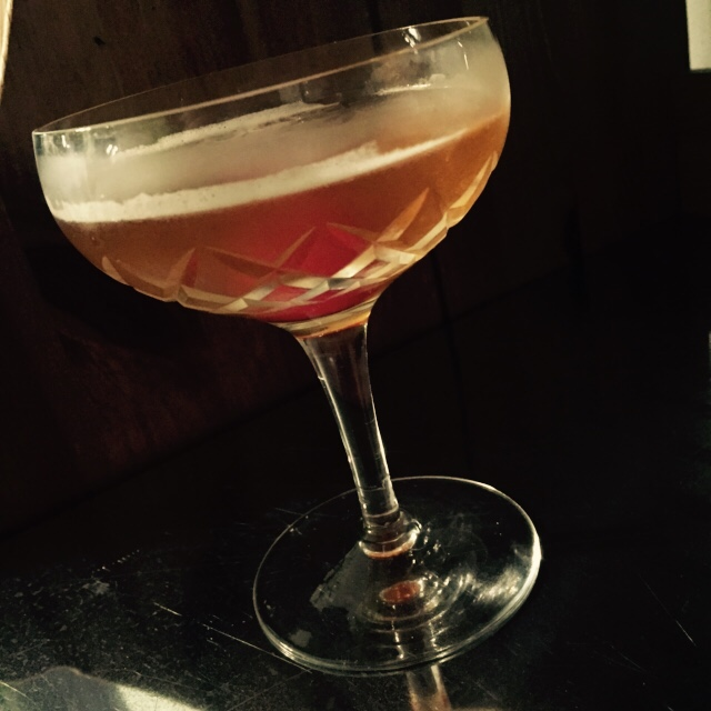 Halloween drink called the Widow's kiss shown in a martini glass