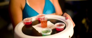 Waitress in a bikini with a tray of gelatin shot at a nightclub
