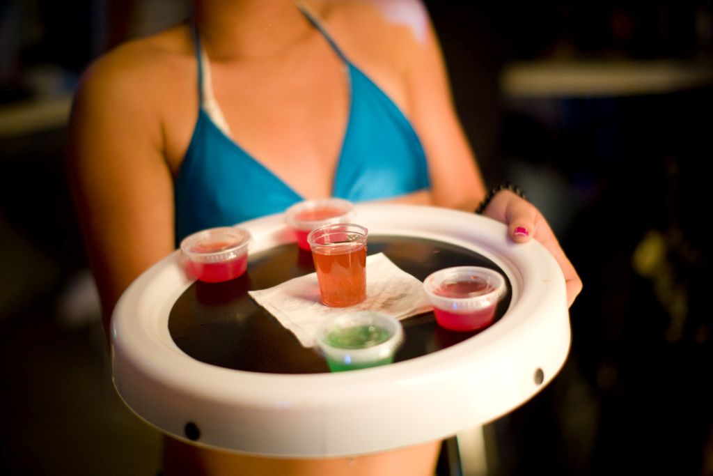 Waitress in a bikini with a tray of gelatin shot at a nightclub